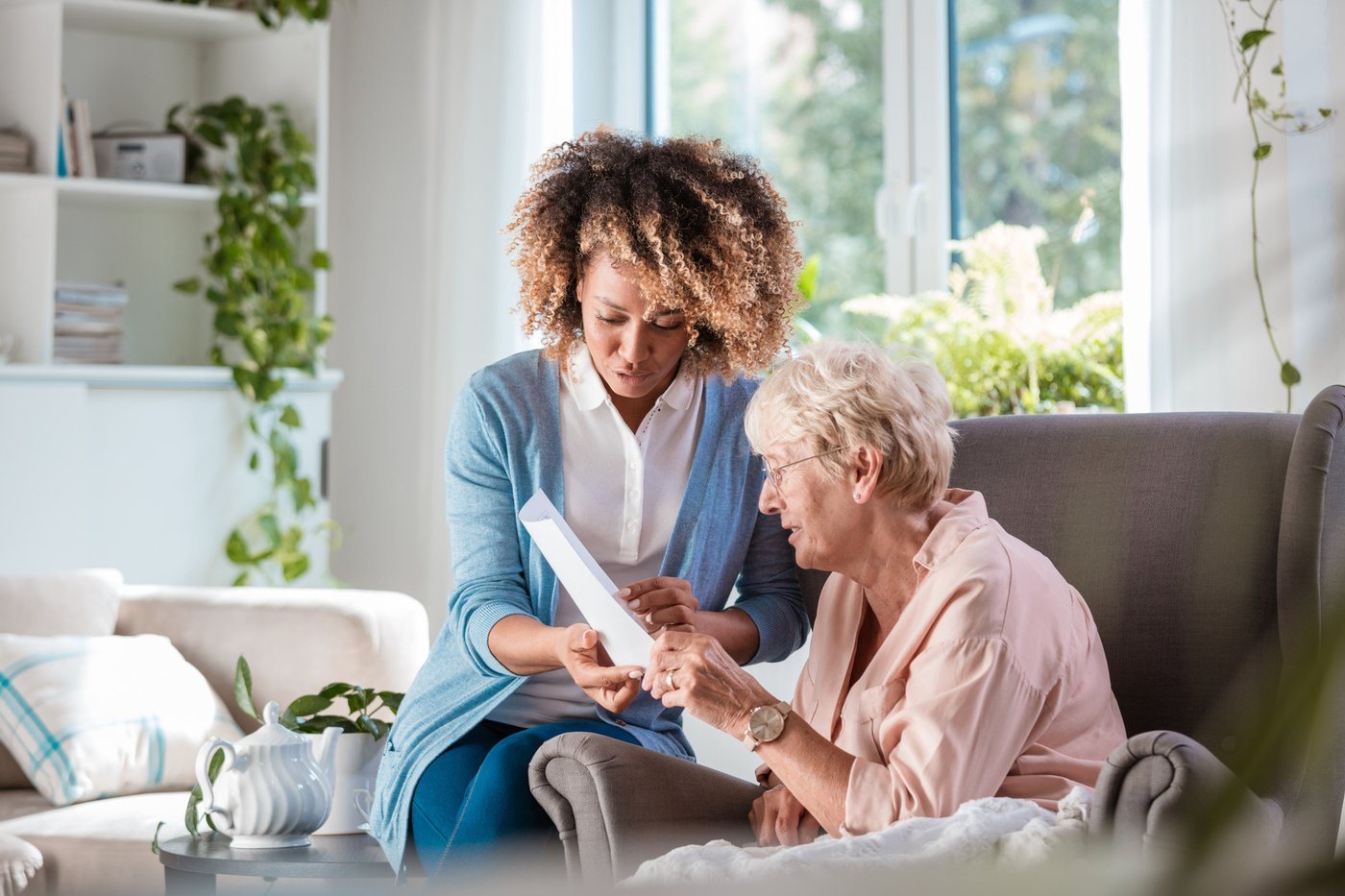 A caregiver sitting with a resident